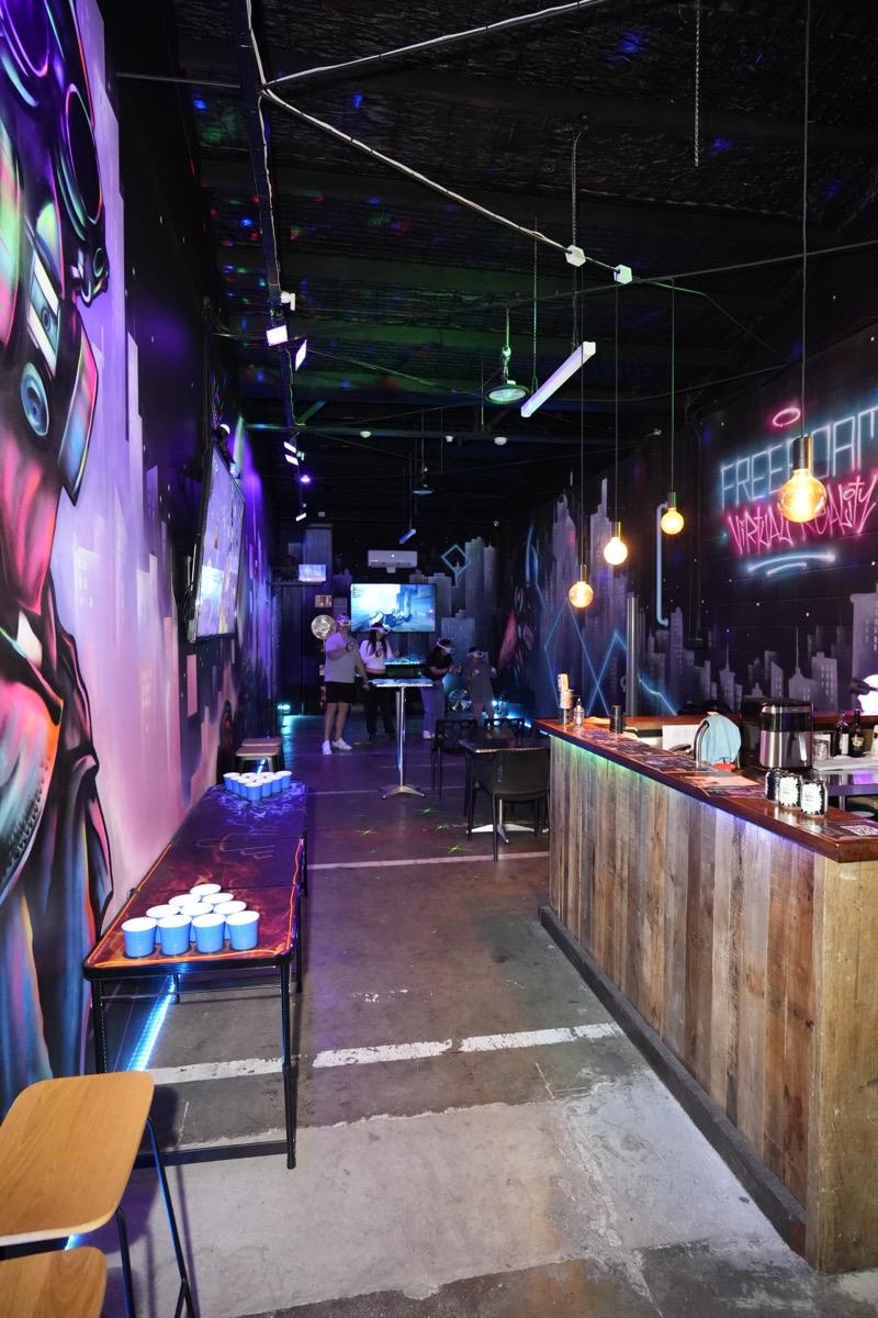 Players in VR headsets beside the AfterDark bar